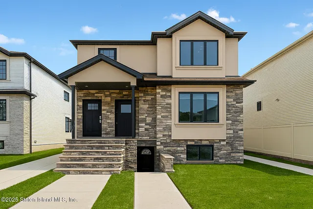 a front view of a house with a yard