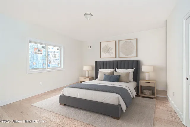 a bedroom with bed and window