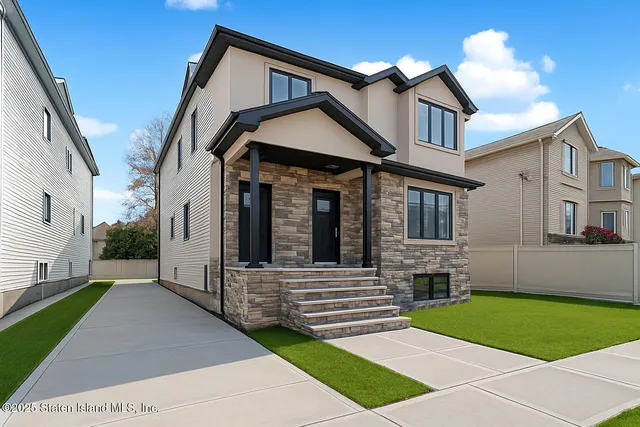 a view of a house with a large space and a yard