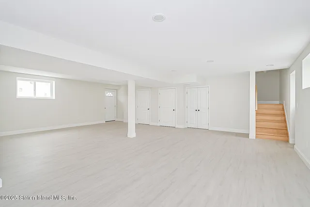 a view of an empty room with a closet