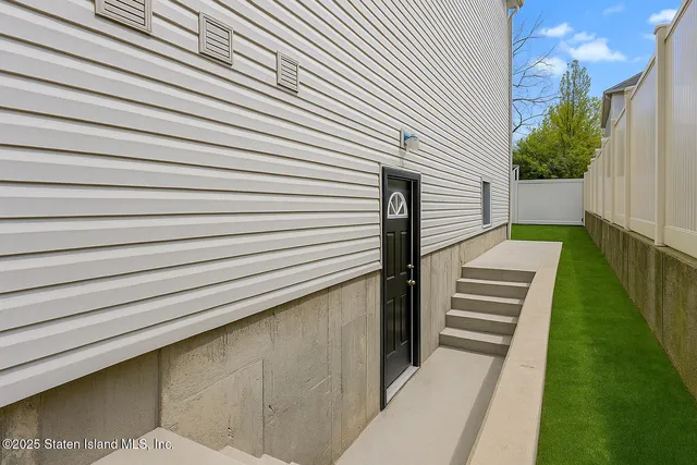 a view of a backyard with sitting area