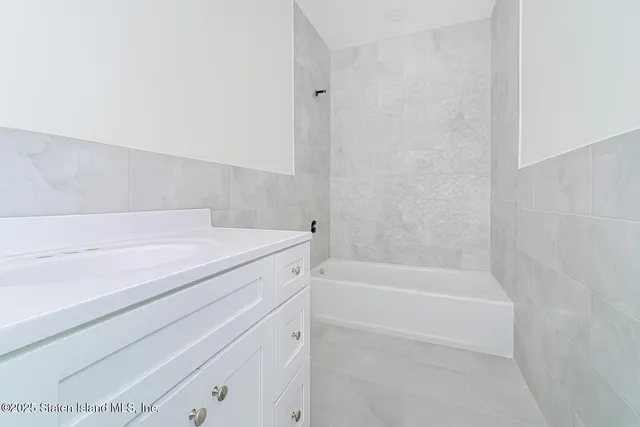 a bathroom with a shower and a bathtub