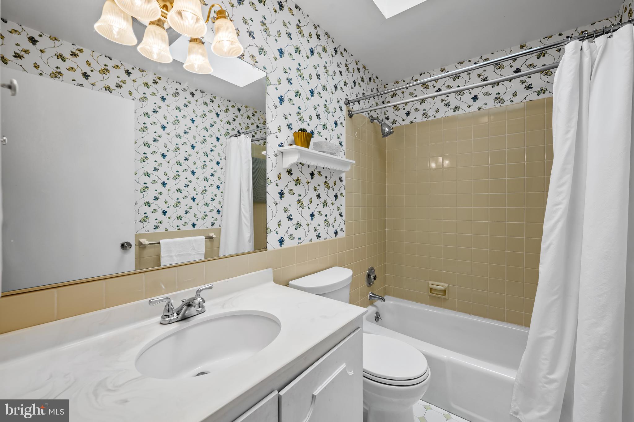 17 Sunnyview Drive Phoenix, MD 21131 - Photo 23 of 48 a bathroom with a sink a toilet and shower curtain