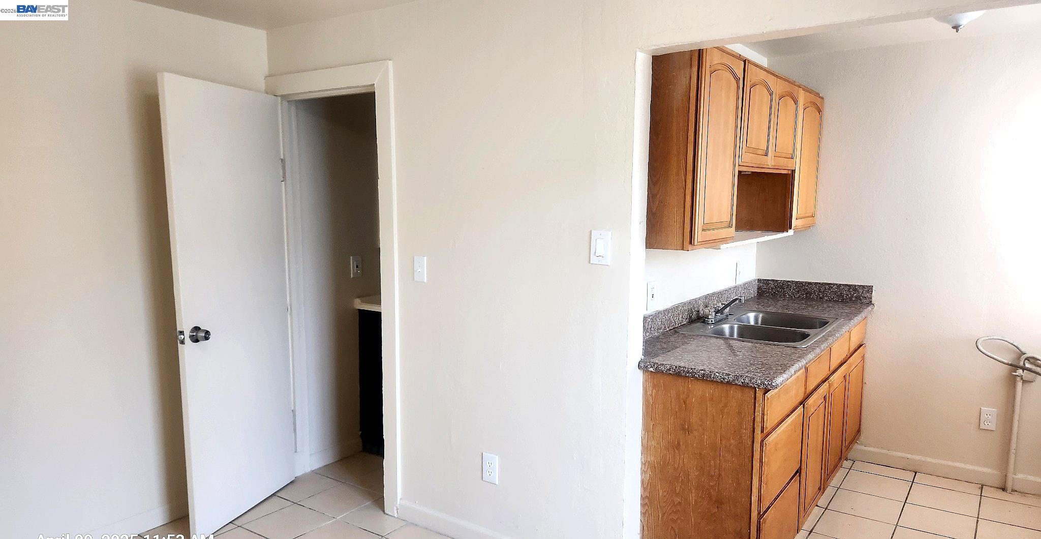 874 Isabella Street Oakland, CA 94607 - Photo 8 of 9 a kitchen with a stove and a refrigerator