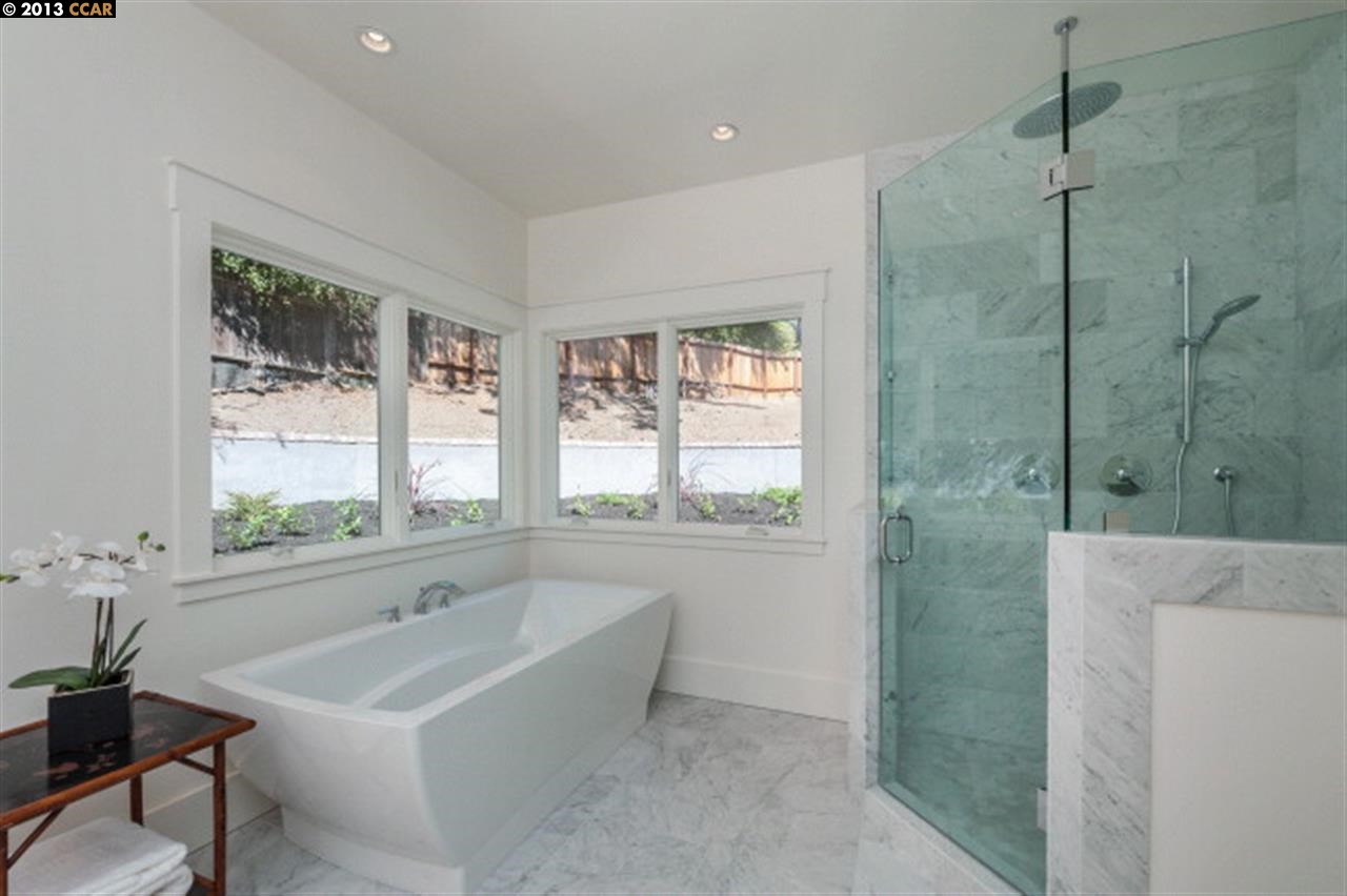 3848 Happy Valley Road Lafayette, CA 94549 - Photo 17 of 27 a bathroom with a tub sink and mirror