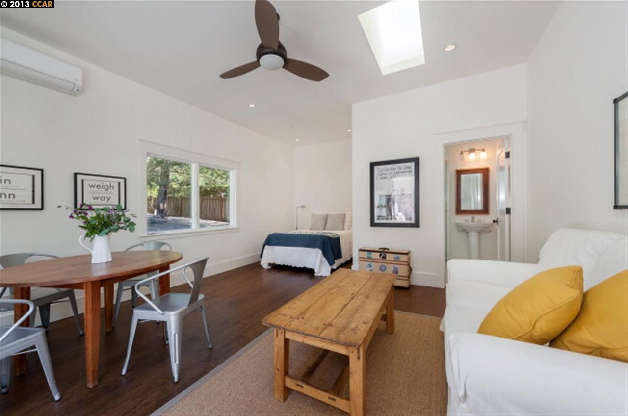 3848 Happy Valley Road Lafayette, CA 94549 - Photo 23 of 27 a bedroom with furniture and a wooden floor