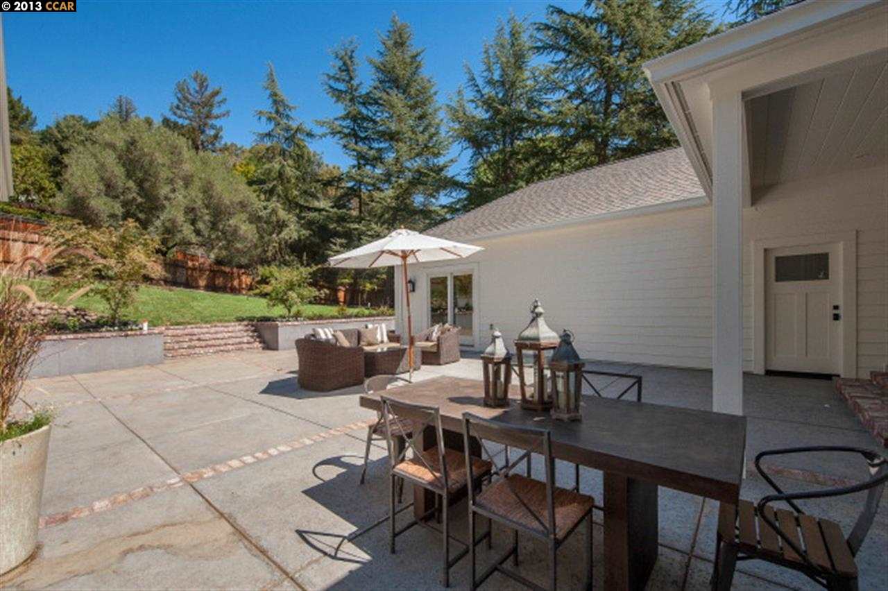 3848 Happy Valley Road Lafayette, CA 94549 - Photo 24 of 27 a view of a patio with table and chairs with wooden floor and fence