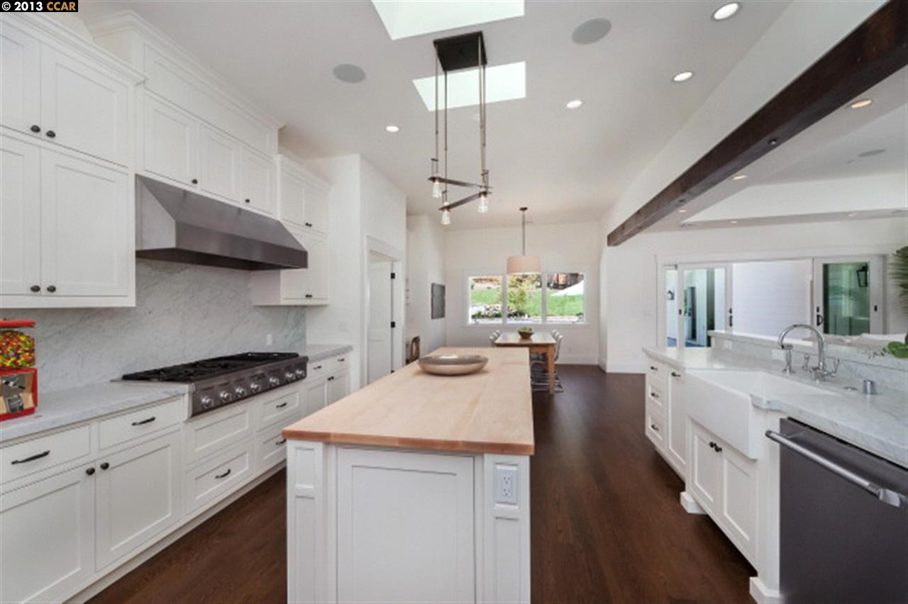 3848 Happy Valley Road Lafayette, CA 94549 - Photo 8 of 27 a kitchen with stainless steel appliances kitchen island a sink stove and cabinets