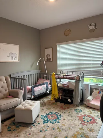 a living room with furniture a couch and a window