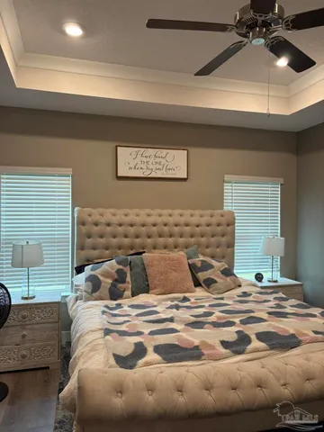 a bedroom with a bed and lamp