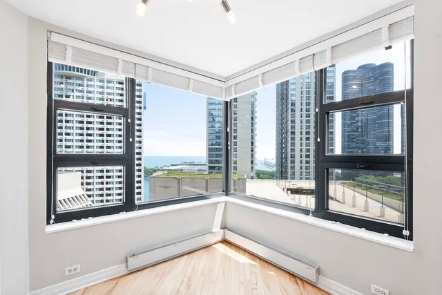 a view of bathroom with a large window and tub