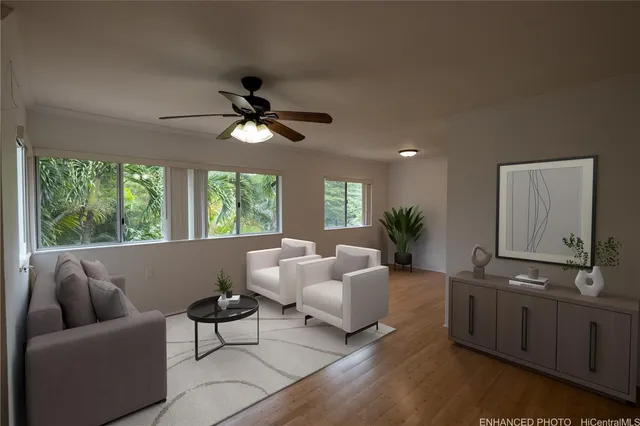 a living room with furniture and a large window