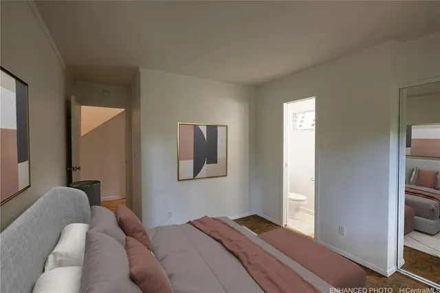 a bedroom with a bed and a painting