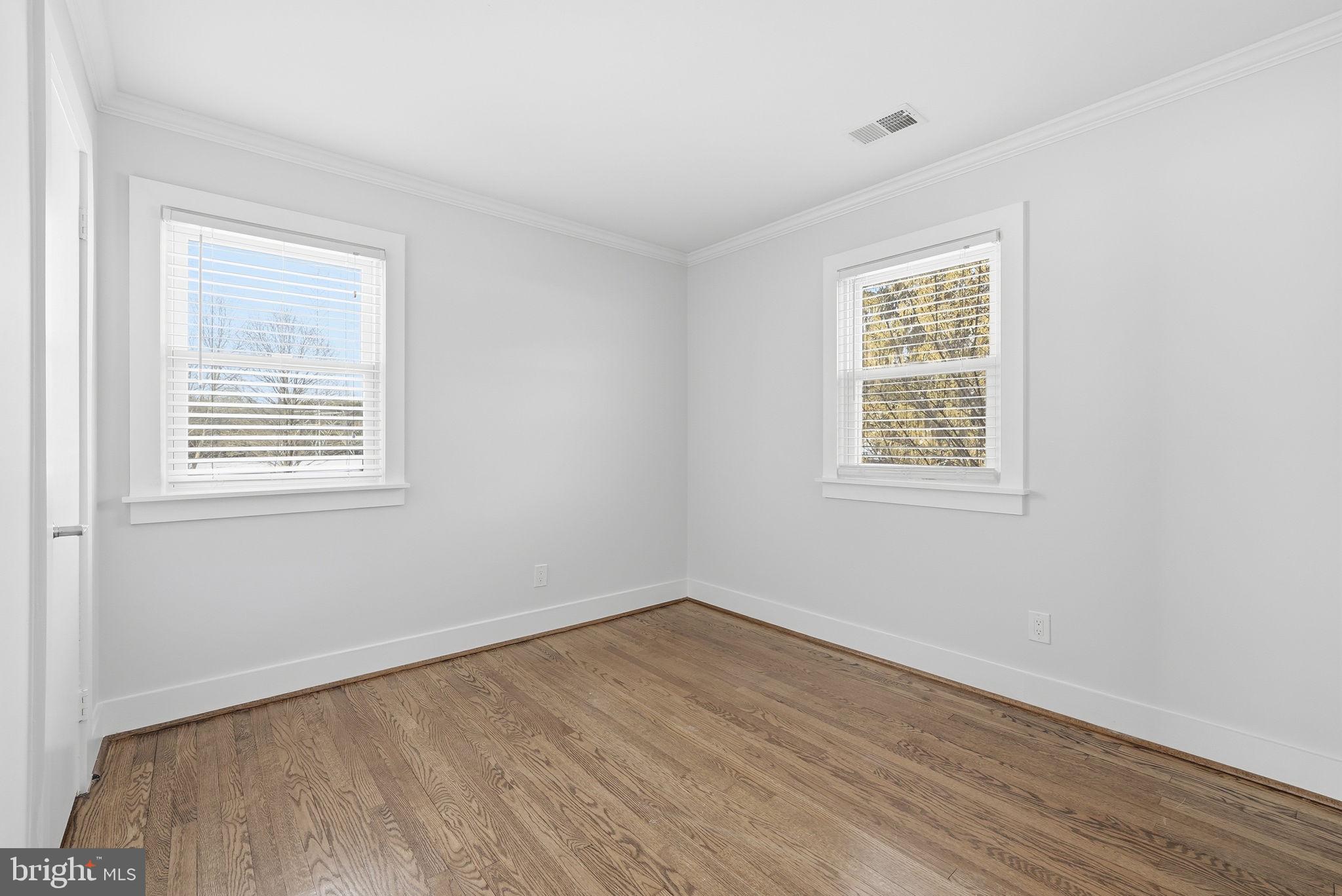 17509 Black Rock Road Germantown, MD 20874 - Photo 12 of 26 a view of an empty room with wooden floor and a window
