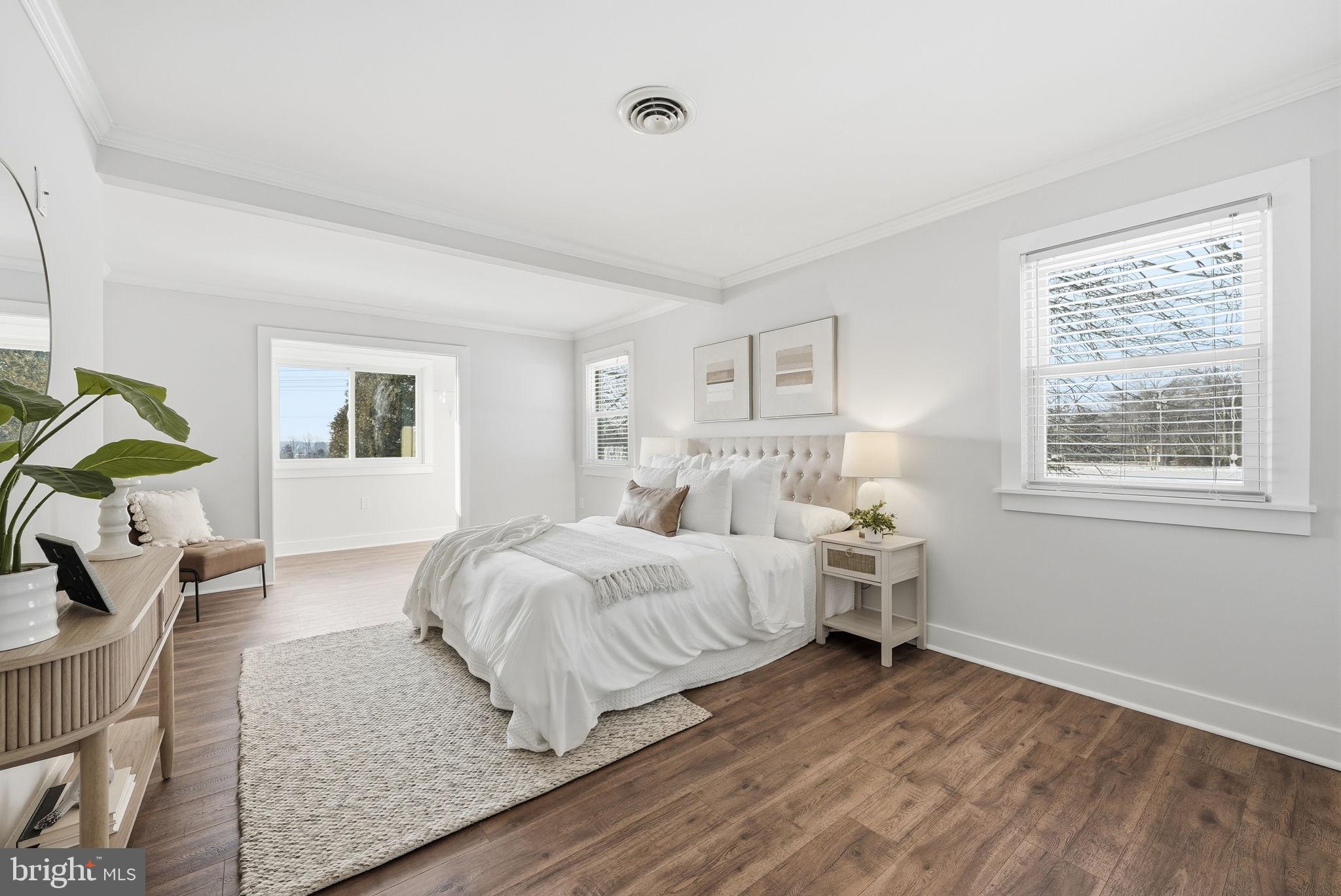 17509 Black Rock Road Germantown, MD 20874 - Photo 16 of 26 a bedroom with a bed and wooden floor