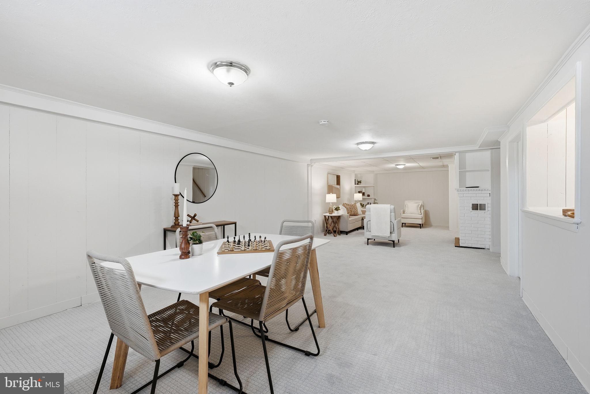 17509 Black Rock Road Germantown, MD 20874 - Photo 18 of 26 a view of a dining room with furniture and a chandelier