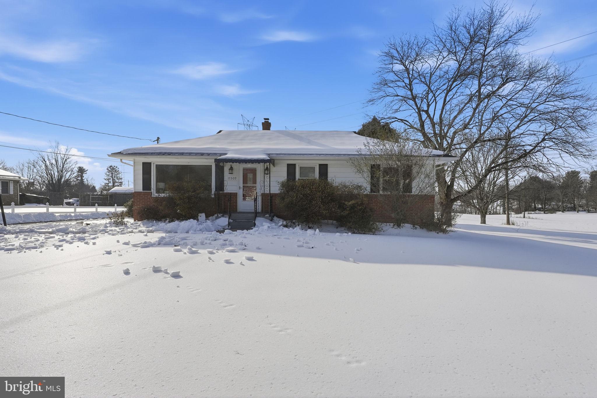 17509 Black Rock Road Germantown, MD 20874 - Photo 3 of 26 a front view of a house with a yard