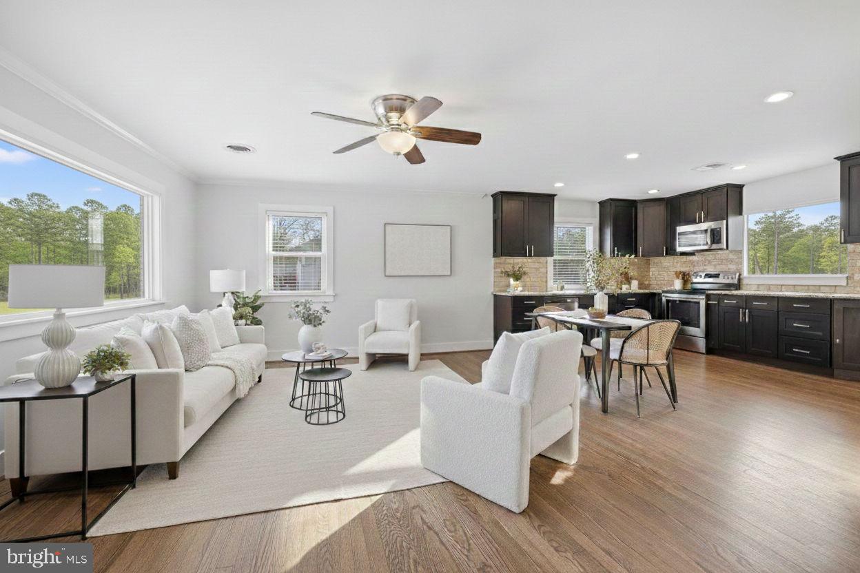 17509 Black Rock Road Germantown, MD 20874 - Photo 5 of 26 a living room with furniture kitchen view and a large window