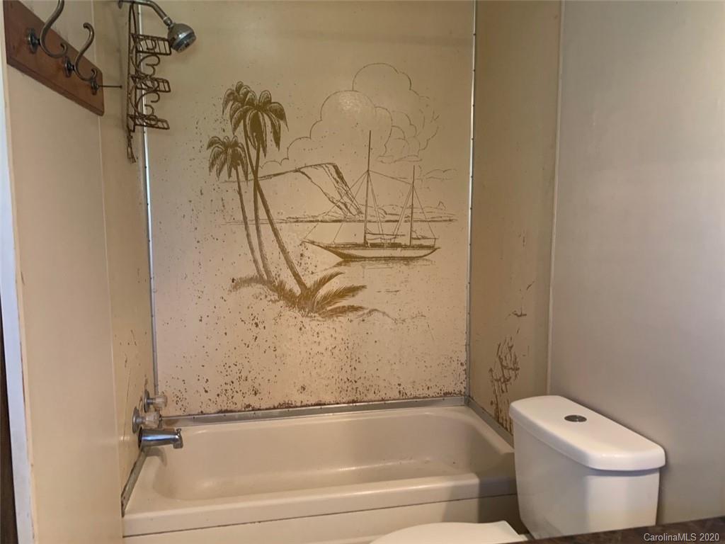 1733 Canal Road Catawba, SC 29704 - Photo 12 of 12 a bathroom with a toilet and a bathtub