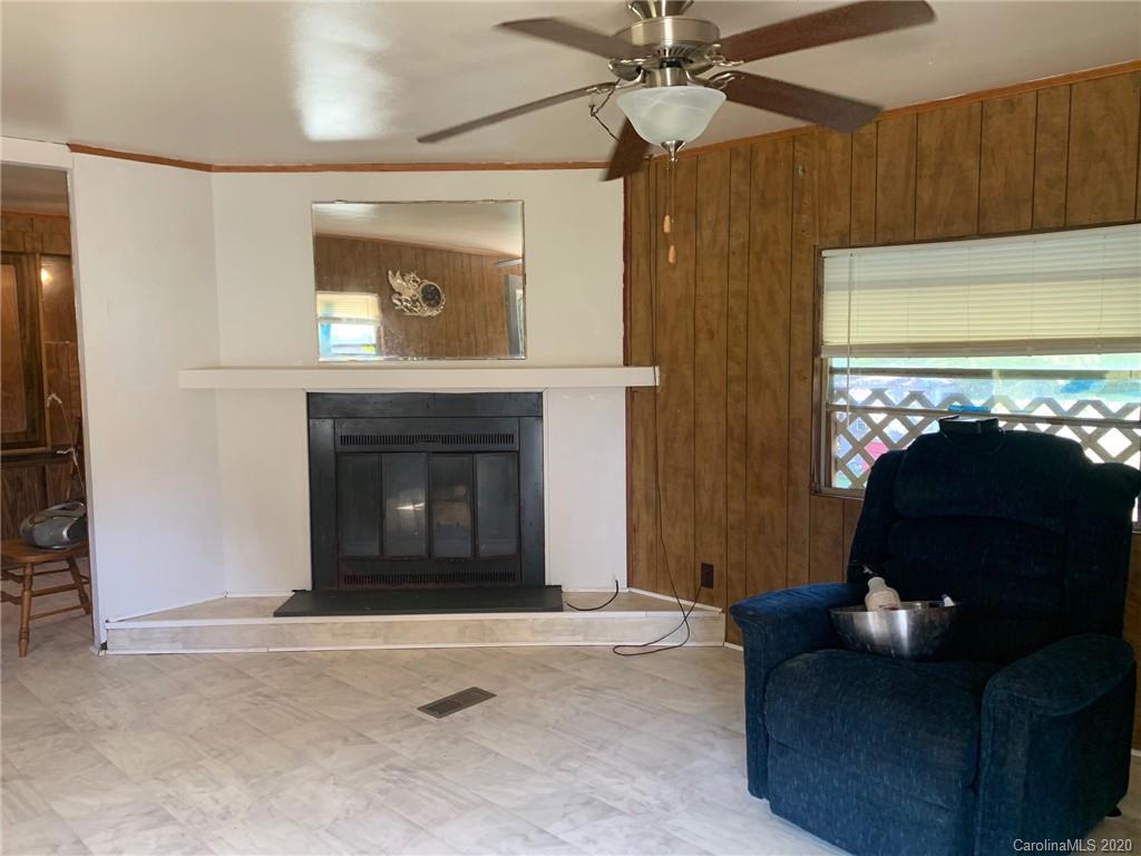 1733 Canal Road Catawba, SC 29704 - Photo 3 of 12 a living room with furniture and a fireplace