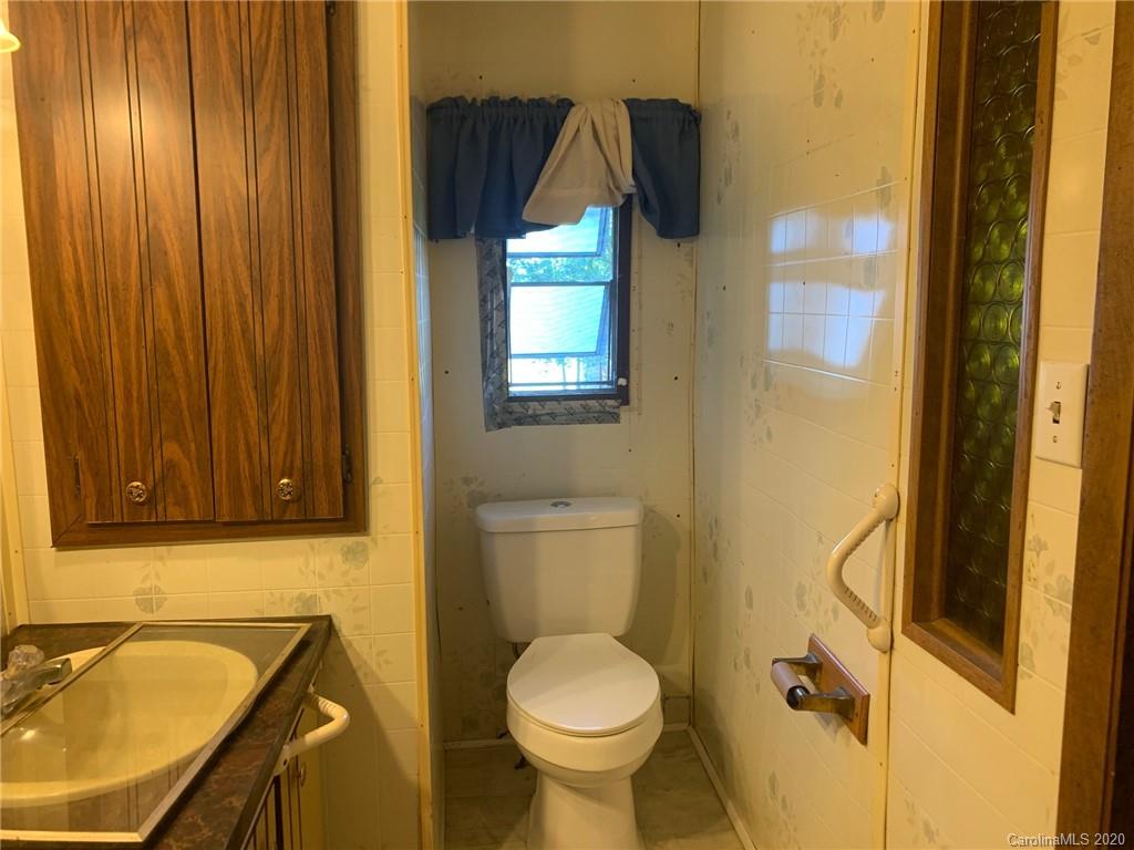 1733 Canal Road Catawba, SC 29704 - Photo 4 of 12 a bathroom with a toilet sink and mirror