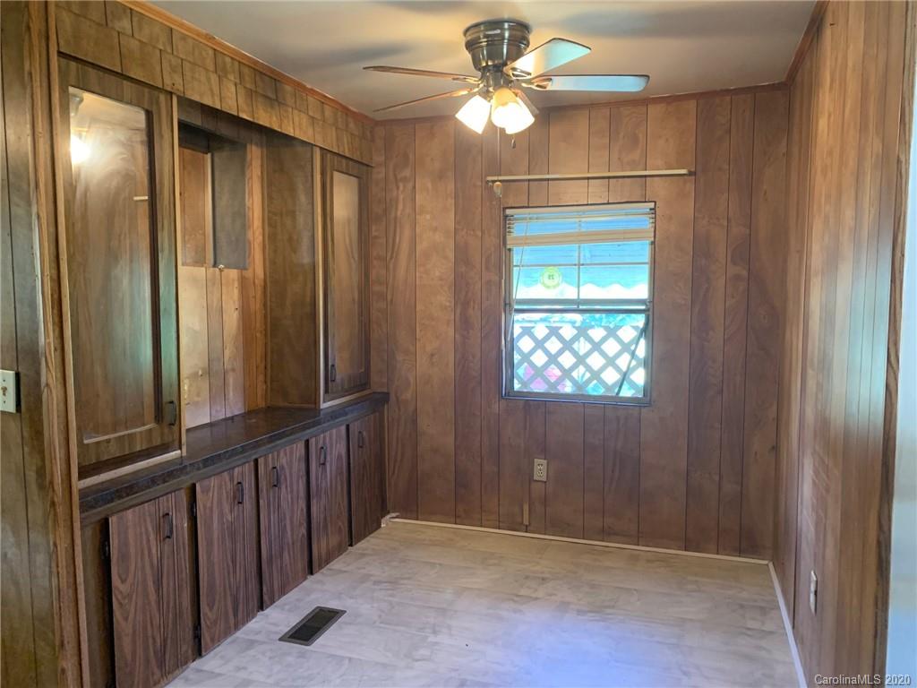 1733 Canal Road Catawba, SC 29704 - Photo 6 of 12 an empty room with windows fan and front door