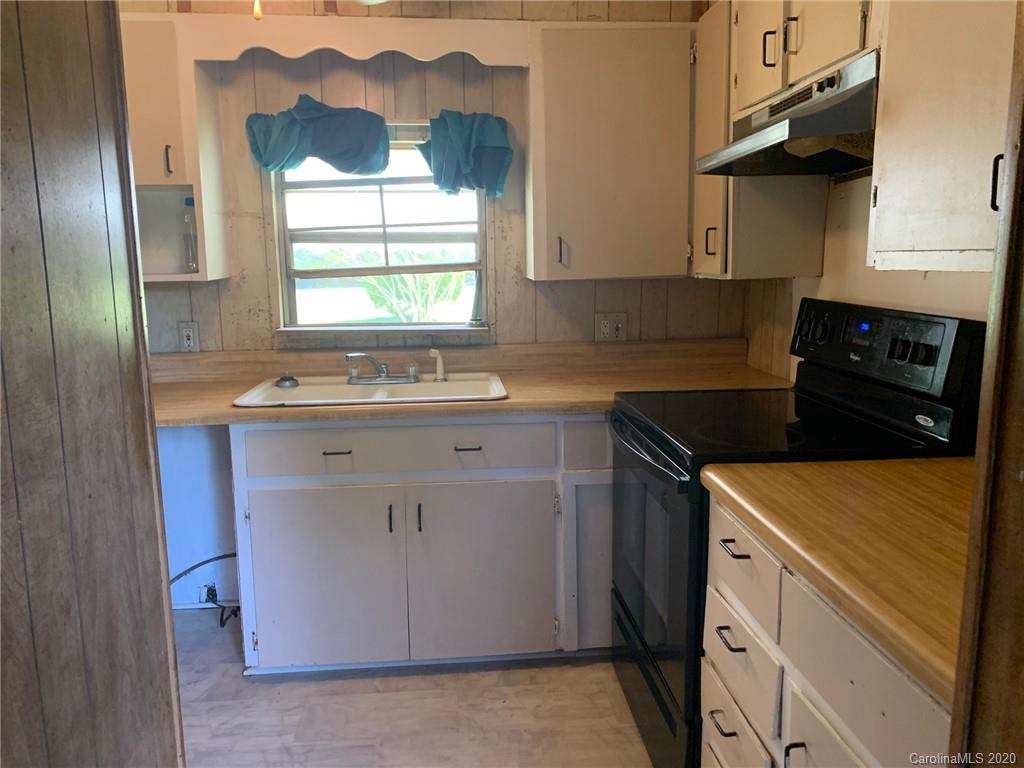 1733 Canal Road Catawba, SC 29704 - Photo 8 of 12 a kitchen with a sink stove and cabinets