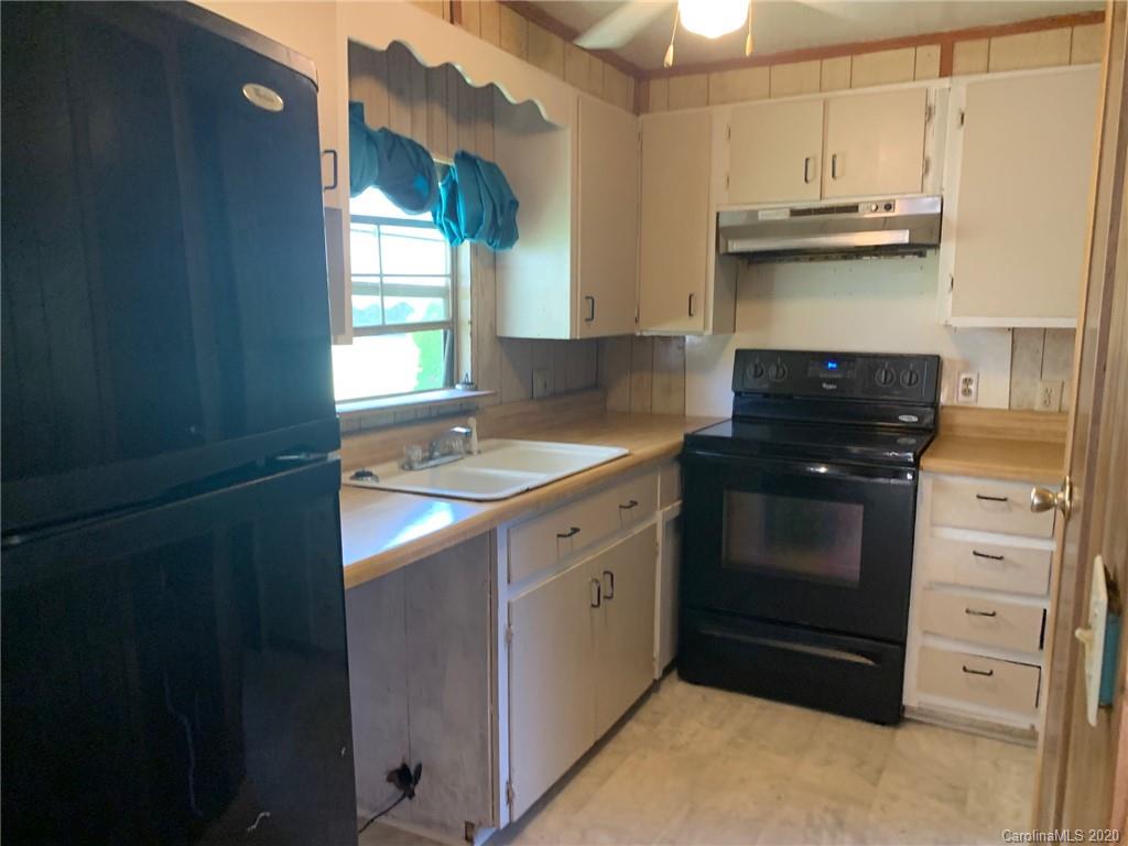 1733 Canal Road Catawba, SC 29704 - Photo 9 of 12 a kitchen with stainless steel appliances granite countertop a stove and a refrigerator