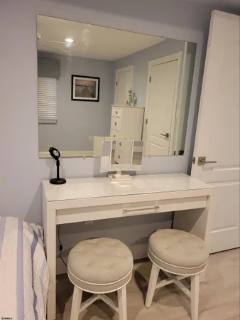 a room with a table chairs and a potted plant