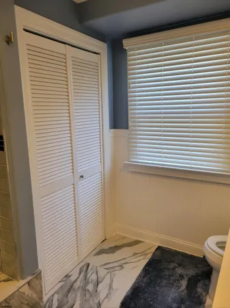 a view of a room that has a window in it