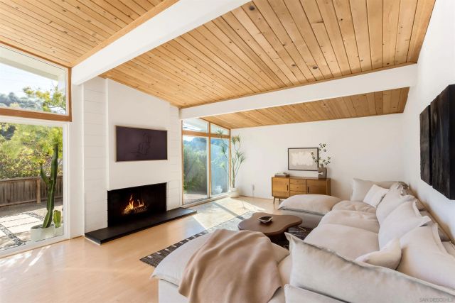 a bedroom with furniture and a fireplace