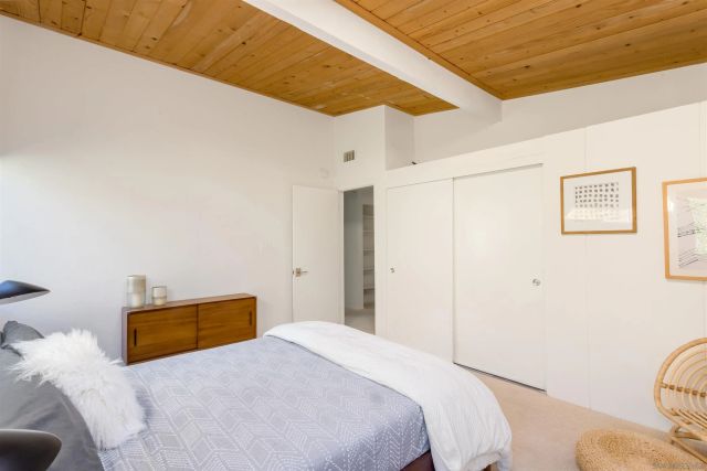 a bedroom with a bed and a cabinets