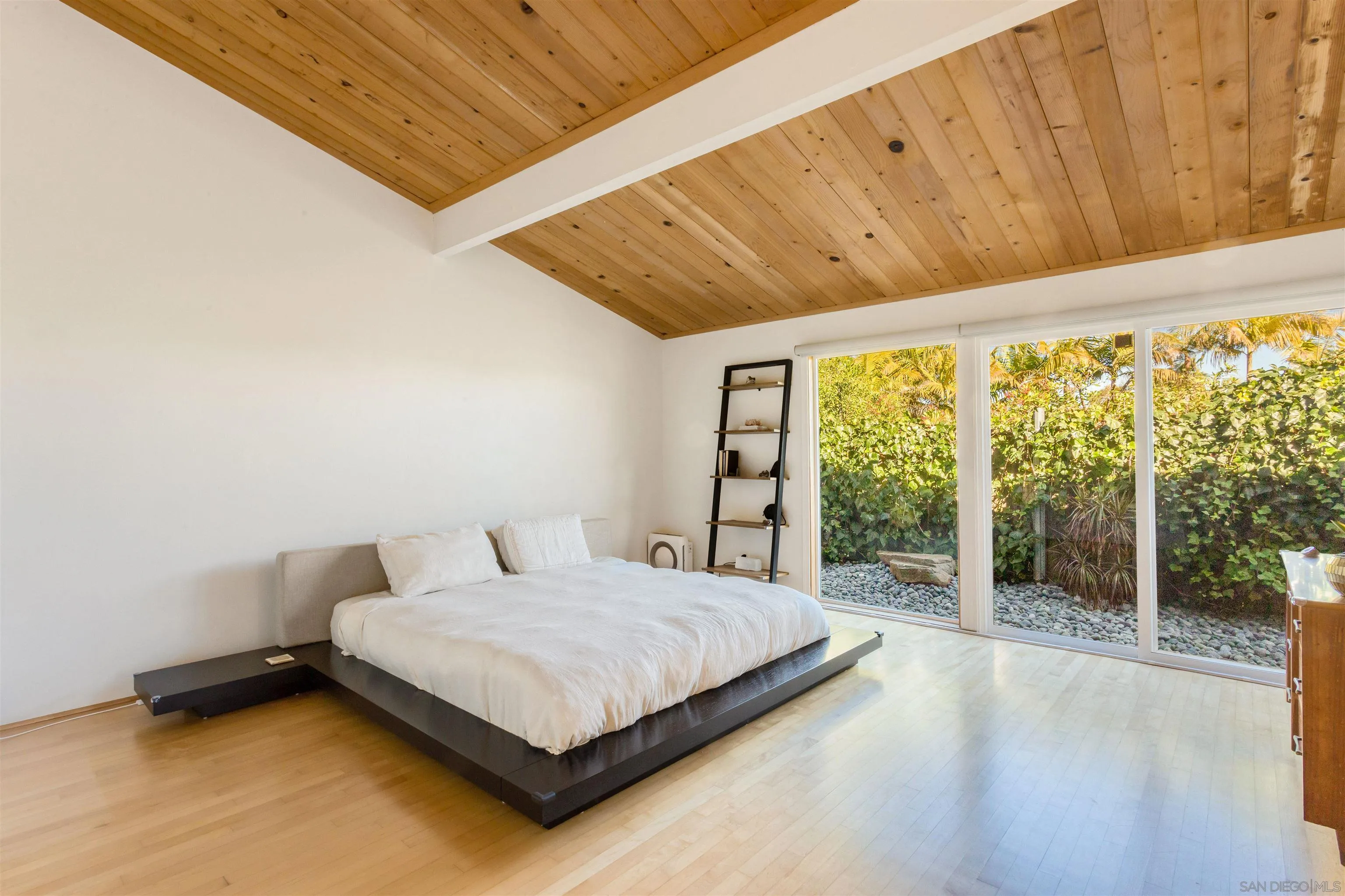 3084 Cranbrook Court La Jolla, CA 92037 - Photo 10 of 34 a bedroom with a bed and a large window