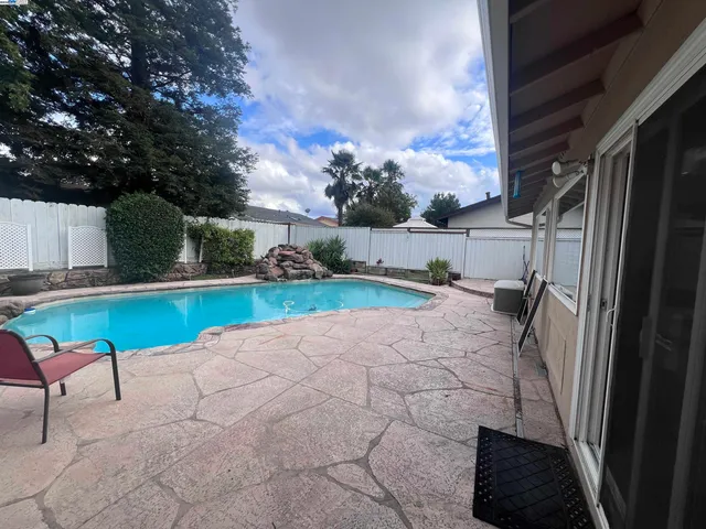 a view of backyard with outdoor seating