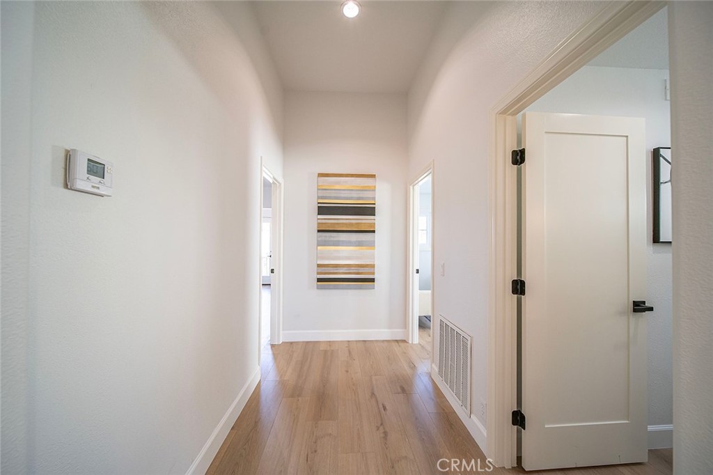 20 Flores Lake Forest, CA 92610 - Photo 54 of 61 a view of a hallway with wooden floor and closet