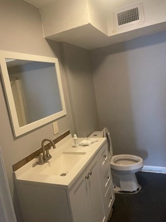 526 Third Street, Unit 6 Fall River, MA 02721 - Photo 3 of 3 a bathroom with a sink toilet and mirror