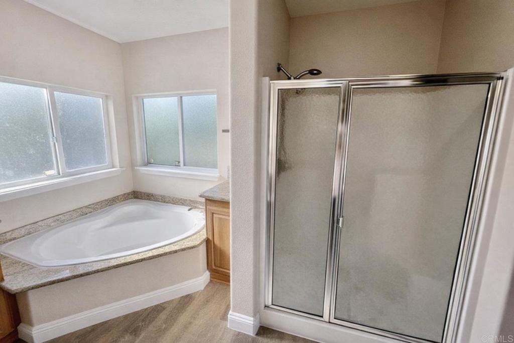 441 Rancho Santa Fe Road Encinitas, CA 92024 - Photo 12 of 17 a bathroom with a bathtub and a shower