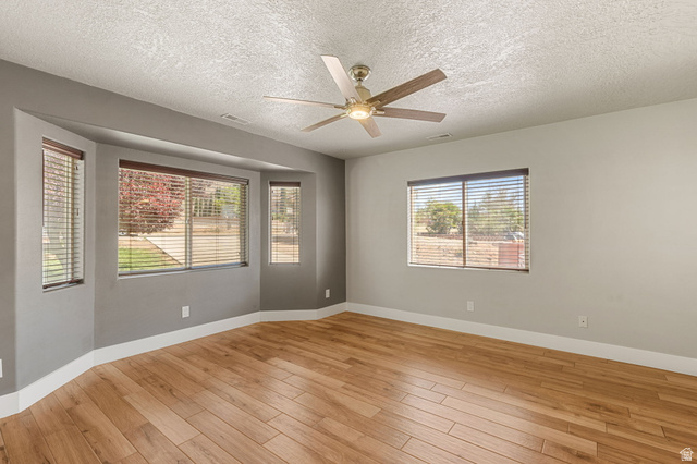 55 Spring Drive Toquerville, UT 84774 - Photo 14 of 36 Primary with light wood-style floors, ceiling fan, and a textured ceiling