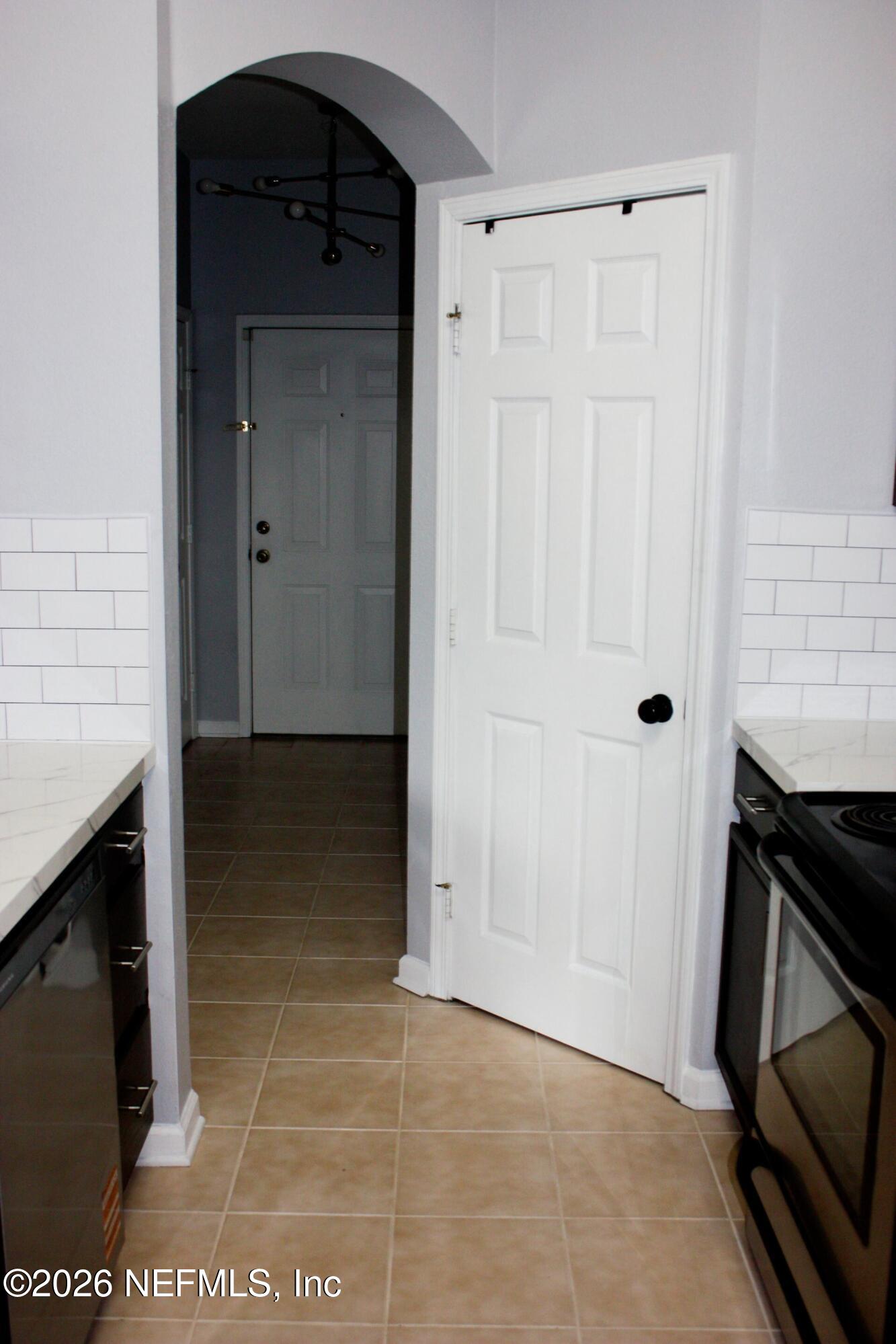 7990 Baymeadows Road East, Unit 530 Jacksonville, FL 32256 - Photo 8 of 21 a view of an empty room with a fireplace and a window