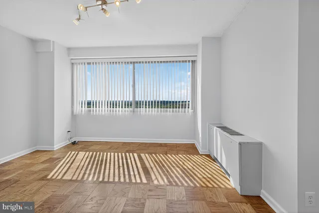 a bathroom with a granite countertop sink toilet and a mirror