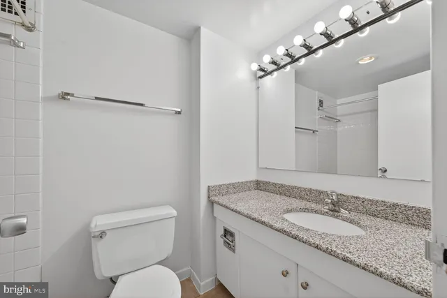 a bathroom with a toilet and bathtub