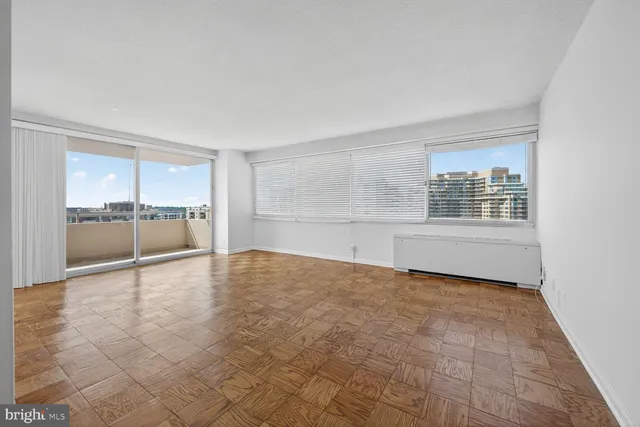 a view of an empty room with a window