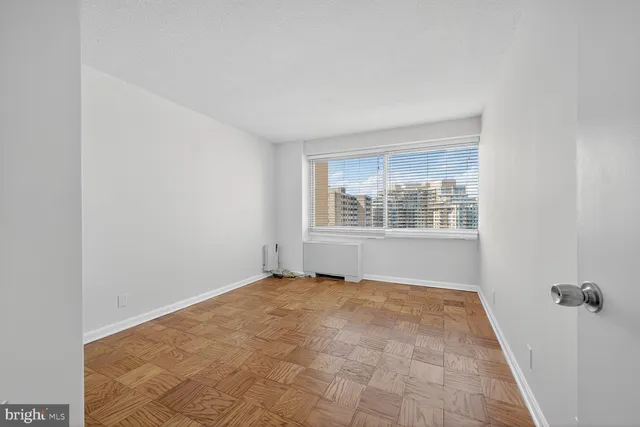 a view of an empty room with a window