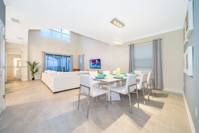 a living room with furniture and a table