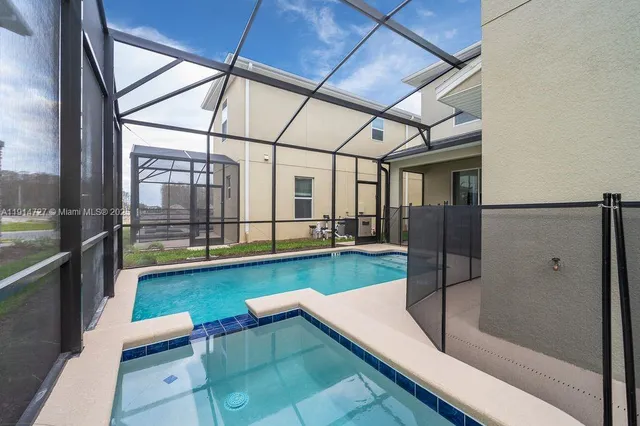 a view of swimming pool with seating area