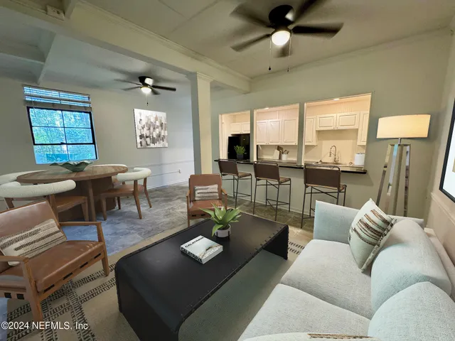 a living room with furniture and a window