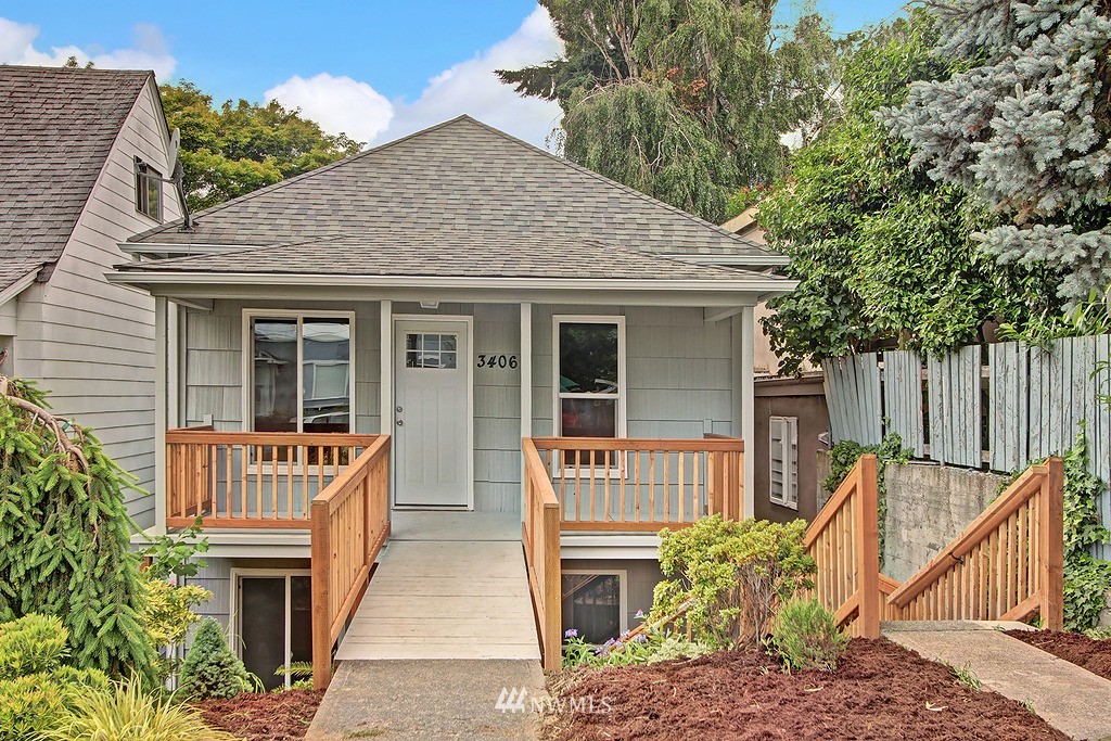 3406 Rockefeller Avenue Everett, WA 98201 - Photo 1 of 9 a front view of a house with barbeque oven and furniture