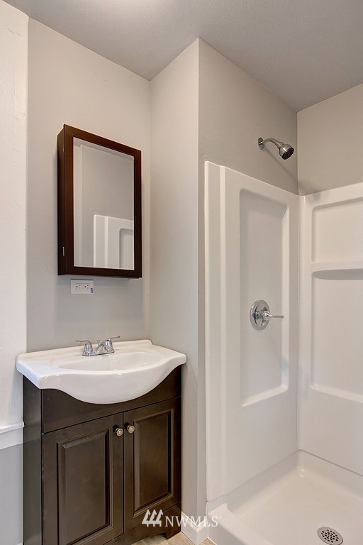 3406 Rockefeller Avenue Everett, WA 98201 - Photo 6 of 9 a bathroom with a sink vanity toilet and shower