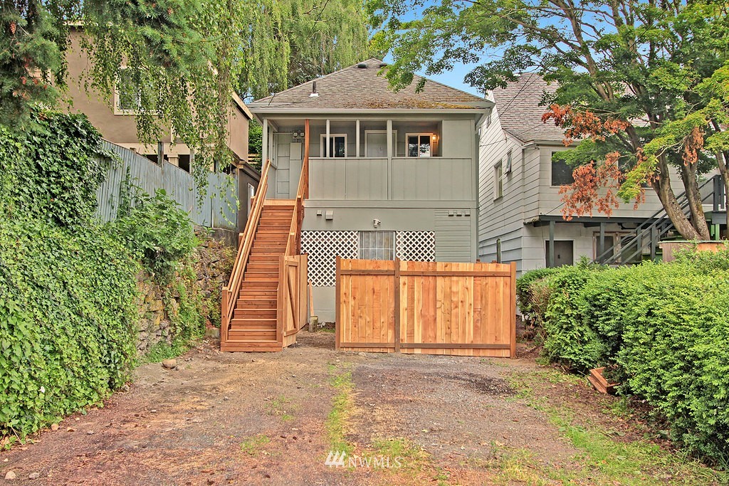3406 Rockefeller Avenue Everett, WA 98201 - Photo 9 of 9 a front view of a house with a yard and garage