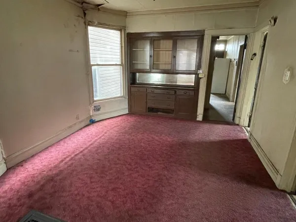 a view of empty room with front door
